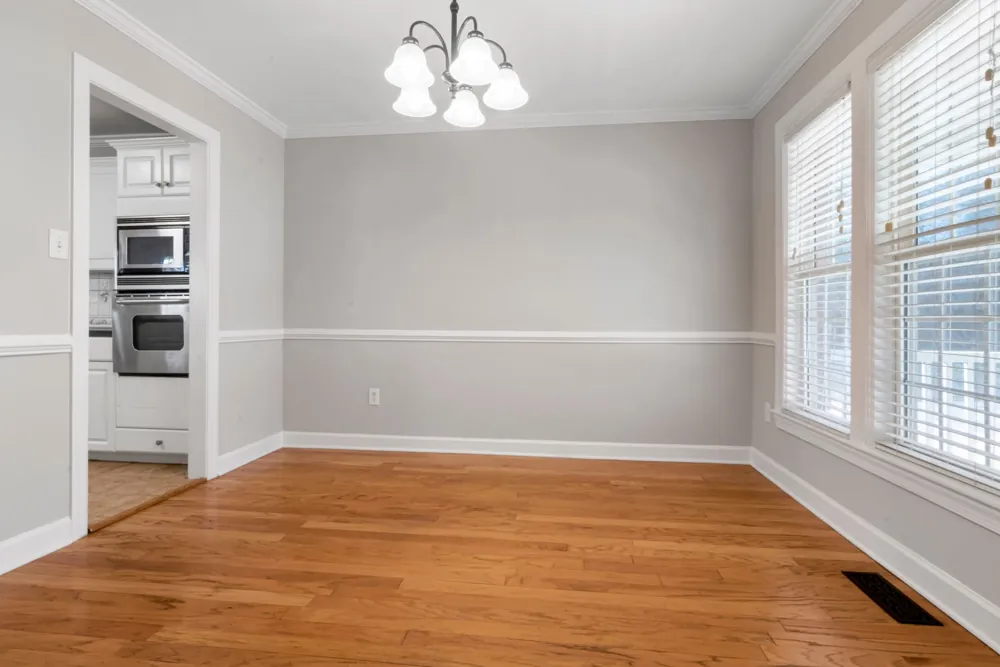Stock photo: bright empty room with polished wooden floor and large windows